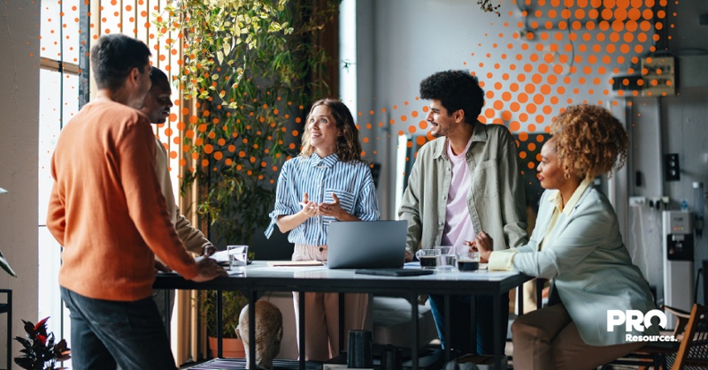 small business owner discussing benefits plan with employees